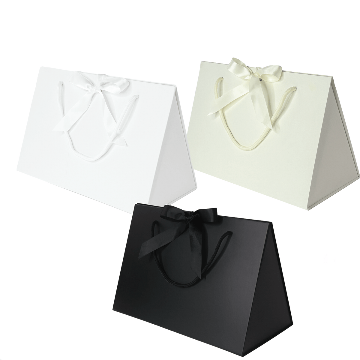 Three triangular gift boxes in black, white, and ivory with satin ribbons on a white background.