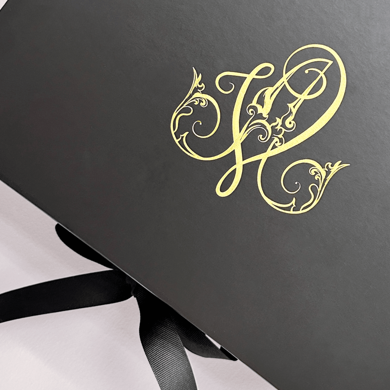 black gift box with custom print in gold foil for St Regis Hotel 