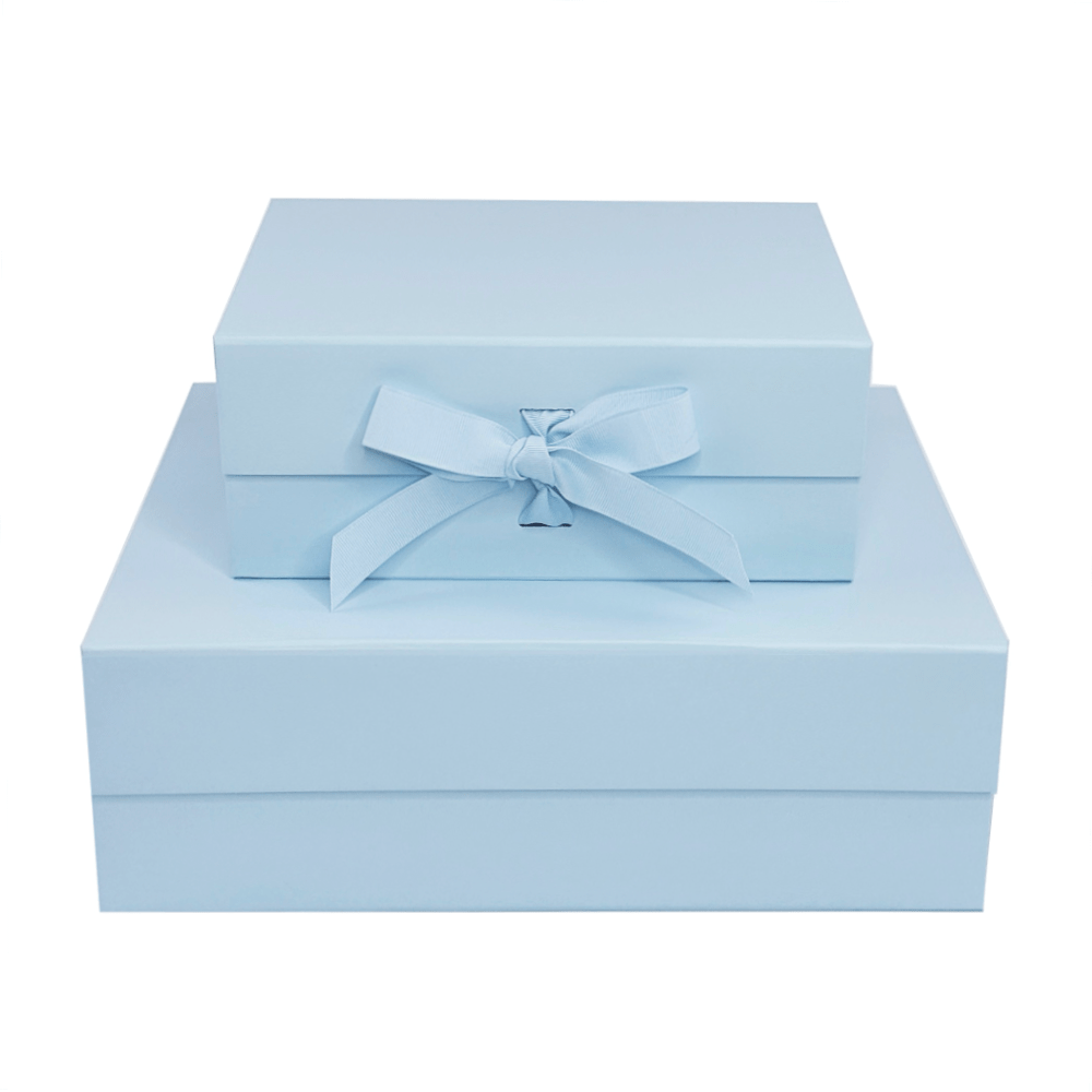 Light blue gift box with a ribbon on a white background