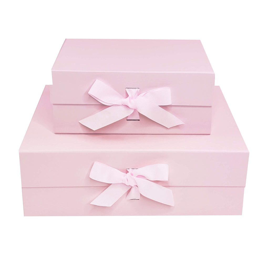 light pink fold flat magnetic closure gift boxes shown with chnageble ribbon in medium and large 