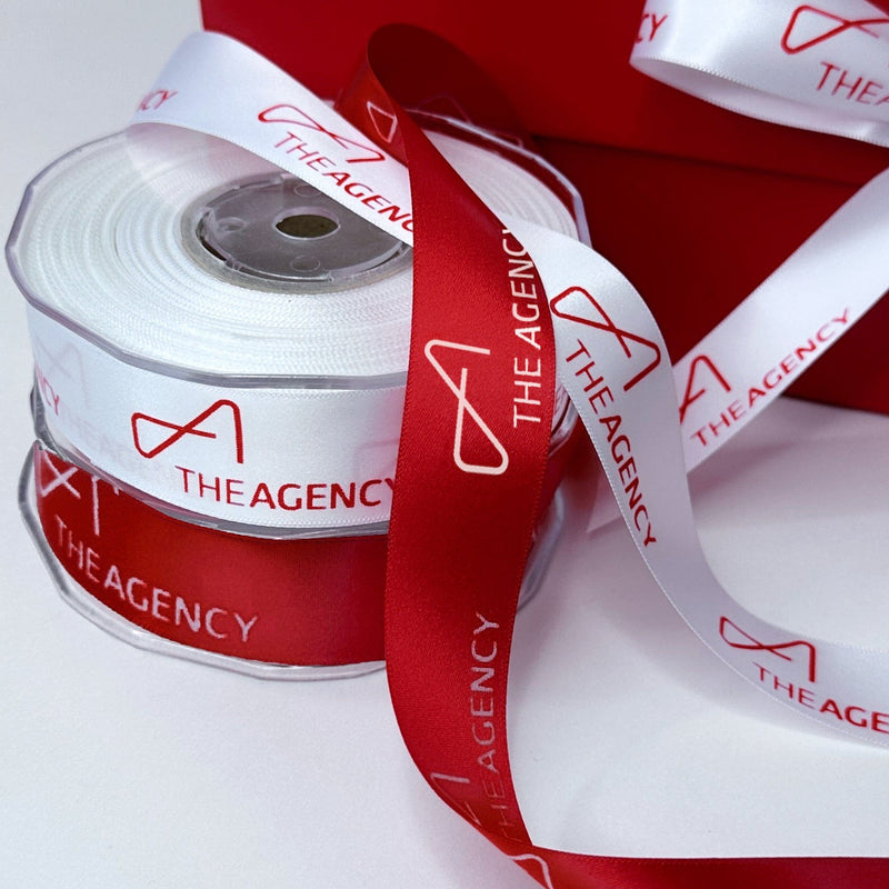 Real estate client gift box tied with a custom logo satin ribbon