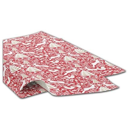 red holiday tissue paper with gold and white deer and Christmas trees