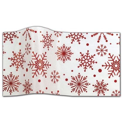 white tissue paper with red snowflakes