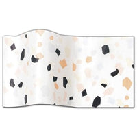 White tissue paper with a multi-colored terrazzo pattern